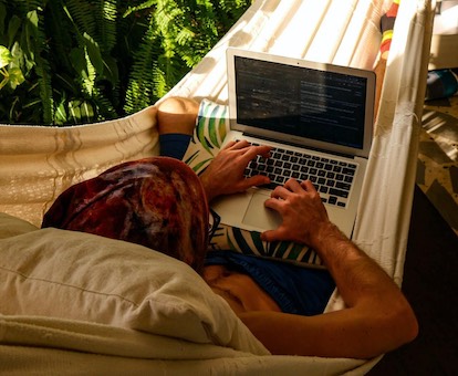 in hammock with laptop